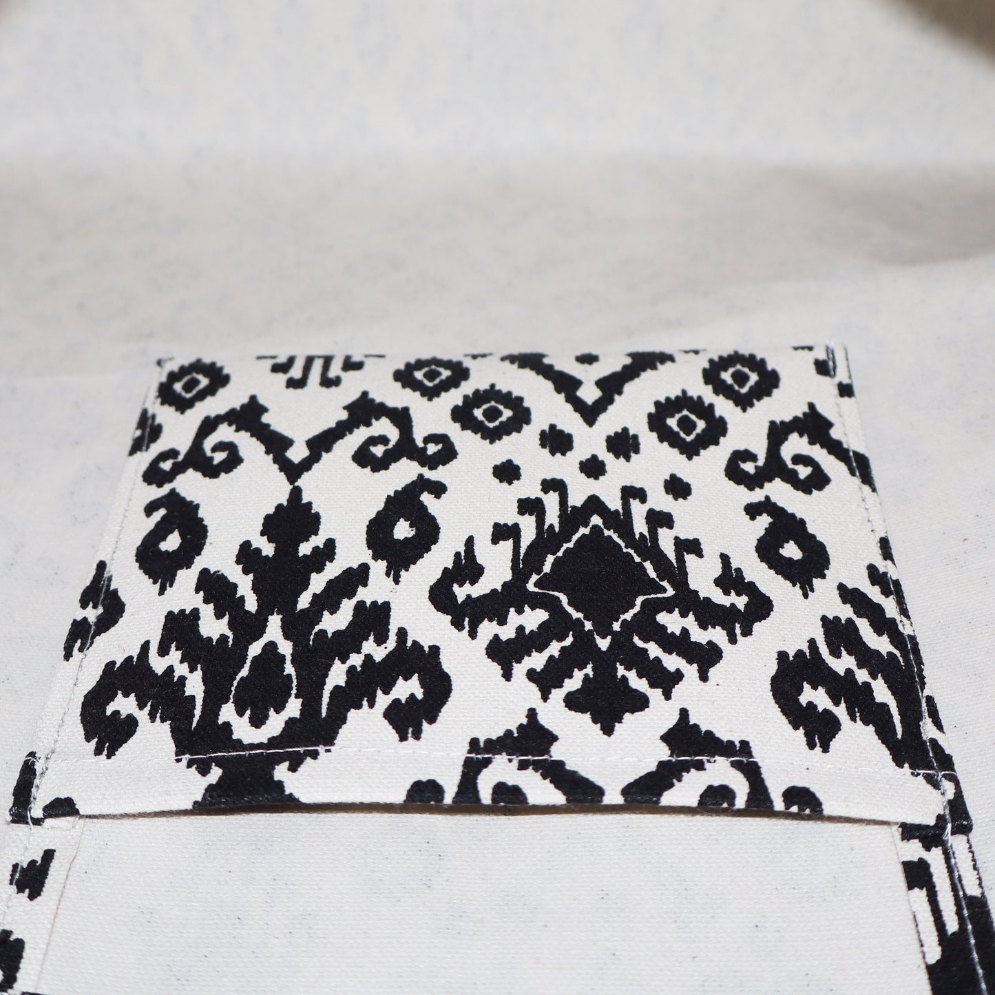 MAKE A STATEMENT WITH THE BOHO NOIR CARRYALL, WHERE BOHEMIAN CHARM MEETS MODERN FUNCTIONALITY